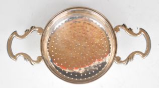 Georgian hallmarked silver twin handled lemon strainer, London 1742, maker Edward Aldridge I,