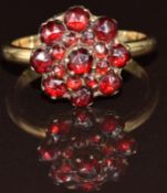 A 9ct gold ring set with a cluster of Bohemian rose cut garnets, 3.4g, size L