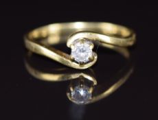 An 18ct gold ring set with a diamond of approximately 0.14ct in a twist setting, 2.4g, size M
