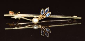 A 15ct gold brooch set with three marquise cut sapphires and a faux pearl, 2.9g, 5cm