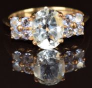 A 9k gold ring set with white topaz and tanzanite, 2.8g, size N