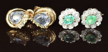 A pair of 9ct gold earrings each set with a pear cut sapphire and green sapphires, and a pair of 9ct
