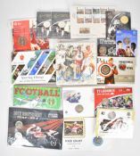 A collection of sporting related coins in presentation packs, including motorcycling TT Races,