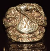 A 9ct gold ring in the form of a horse saddle, 22.7g, size Z