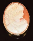 A 9k gold brooch set with a cameo depicting a young woman, 8.3g, 4 x 3cm