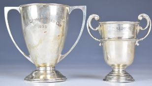 Two George V hallmarked silver twin handled trophy cups, one Mappin & Webb, Sheffield 1939, engraved
