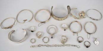 A collection of silver jewellery including seven bangles, bracelet, two christening bracelets, eight