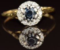 An 18ct gold ring set with a sapphire surrounded by diamonds, 4g, size Z