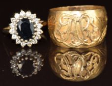 A 9ct gold ring set with a sapphire and cubic zirconia and a yellow metal ring set with initials,