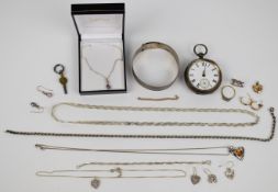 A collection of silver jewellery including bangle, five necklaces, two pairs of earrings and a