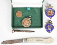 Three hallmarked silver football and skittle medallions including North Gloucestershire Football