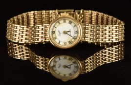 Everite 9ct gold ladies wristwatch with black hands and Roman numerals, white dial and quartz