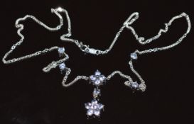 A 9k white gold necklace set with tanzanites in flower clusters, 3.7g, 41cm