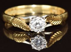 An 18ct gold ring set with a diamond in a platinum setting, 2.6g, size O