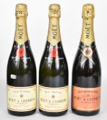 Three bottles of Moët & Chandon Champagne comprising two Brut Impérial and one Brut Impérial Rosé,