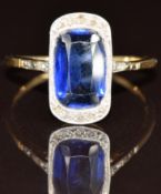 Art Deco 18ct gold ring set with a cushion cut synthetic sapphire and diamonds in a platinum