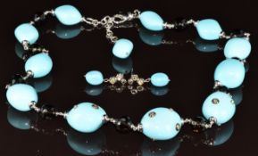 An 18k white gold necklace by Mangiarotti with alternating turquoise and faceted smoky quartz beads,