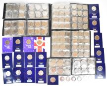 A large collection of collectible 50p coins in folders and coin packs including Falkland Islands, VE