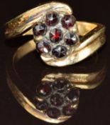 A 14k gold ring set with Bohemian cut garnets, 5g, size M