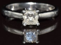 A platinum ring set with a princess cut diamond of approximately 0.38ct, 3.6g, size H