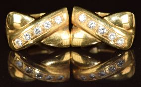 A pair of 18k gold earrings set with diamonds in cross settings, 8.4g