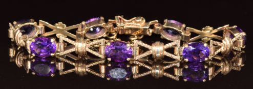 A 9ct gold bracelet set with oval cut amethysts, 13.9g, 16cm