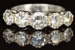 An 18ct white gold ring set with five round cut diamonds of approximately 0.7ct, 0.47ct, 0.5ct, 0.