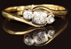 An 18ct gold ring set with three diamonds in a platinum setting, 2.1g, size N