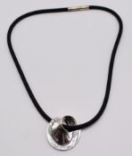 Georg Jensen silver Mobius pendant and rubber chain, in original fitted box