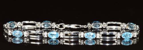 A 9ct white gold bracelet set with topaz and diamonds, 7.1g, 18cm