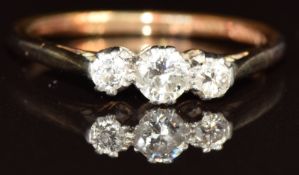 An 18ct gold ring set with three diamonds, the largest approximately 0.2ct, 2.6g, size O/P