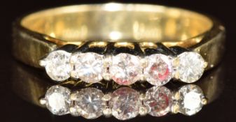 An 18k gold ring set with five diamonds, the total diamond weight approximately 0.35ct, 2.9g, size K