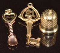 Clogau 9ct gold bi-coloured Welsh spoon charm/ pendant, a 9ct gold charm in the form of a key and 21
