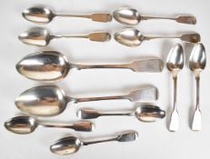 Eleven Georgian and Victorian hallmarked silver fiddle pattern spoons, comprising two table spoons