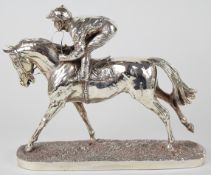 Elizabeth II hallmarked silver novelty model of a jockey riding a horse, on naturalistic base,