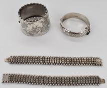 Victorian silver cuff with engraved bird and foliage decoration, two Victorian silver bracelets made