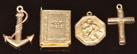 Four 9ct gold charms, a bible, anchor, cross and St Christopher, 2.7g