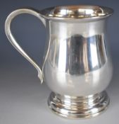 George V hallmarked silver pint tankard of Georgian baluster form, Birmingham 1931, maker Joseph