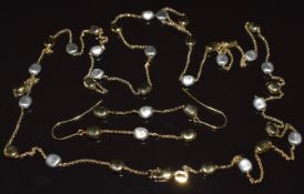 A 9ct gold bi-coloured necklace made up of pebble like beads (80cm) with matching earrings, 7.2g