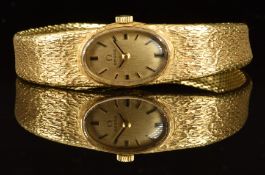 Omega 18ct gold ladies wristwatch with black hands and hour markers, gold dial and signed 17 jewel