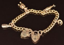A 9ct gold charm bracelet with four 9ct gold charms including Edwardian crescent set with seed