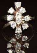 A 14k white gold ring set with ten round cut diamonds, each approximately 0.08ct, in a cluster, 3.
