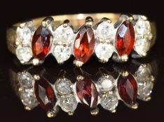 A 9ct gold ring set with garnets and cubic zirconia, 1.8g, size N