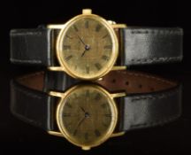 Omega De Ville ladies wristwatch with black hands and Roman numerals, gold dial, gold plated case