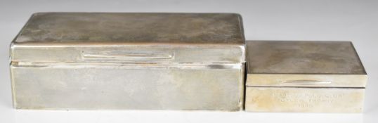 Two Art Deco hallmarked silver cigarette boxes with engine turned decoration, larger London 1928,