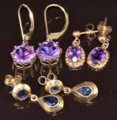 Two pairs of 9ct gold earrings set with amethysts and a pair of 9ct gold earrings set with iolite,