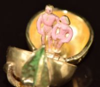 A 9ct gold charm by Nuno in the form of an apple opening to reveal Adam & Eve, 4.5g