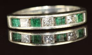A 9ct white gold half eternity ring set with emeralds and princess cut diamonds, 2.7g, size N
