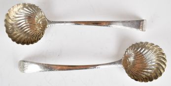 Two Georgian bottom hallmarked silver ladles with shell bowls and feather banded decoration, marks