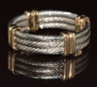 A 9ct gold bi-coloured ring made up of three rope twist rings and yellow gold spacers, 5g, size J